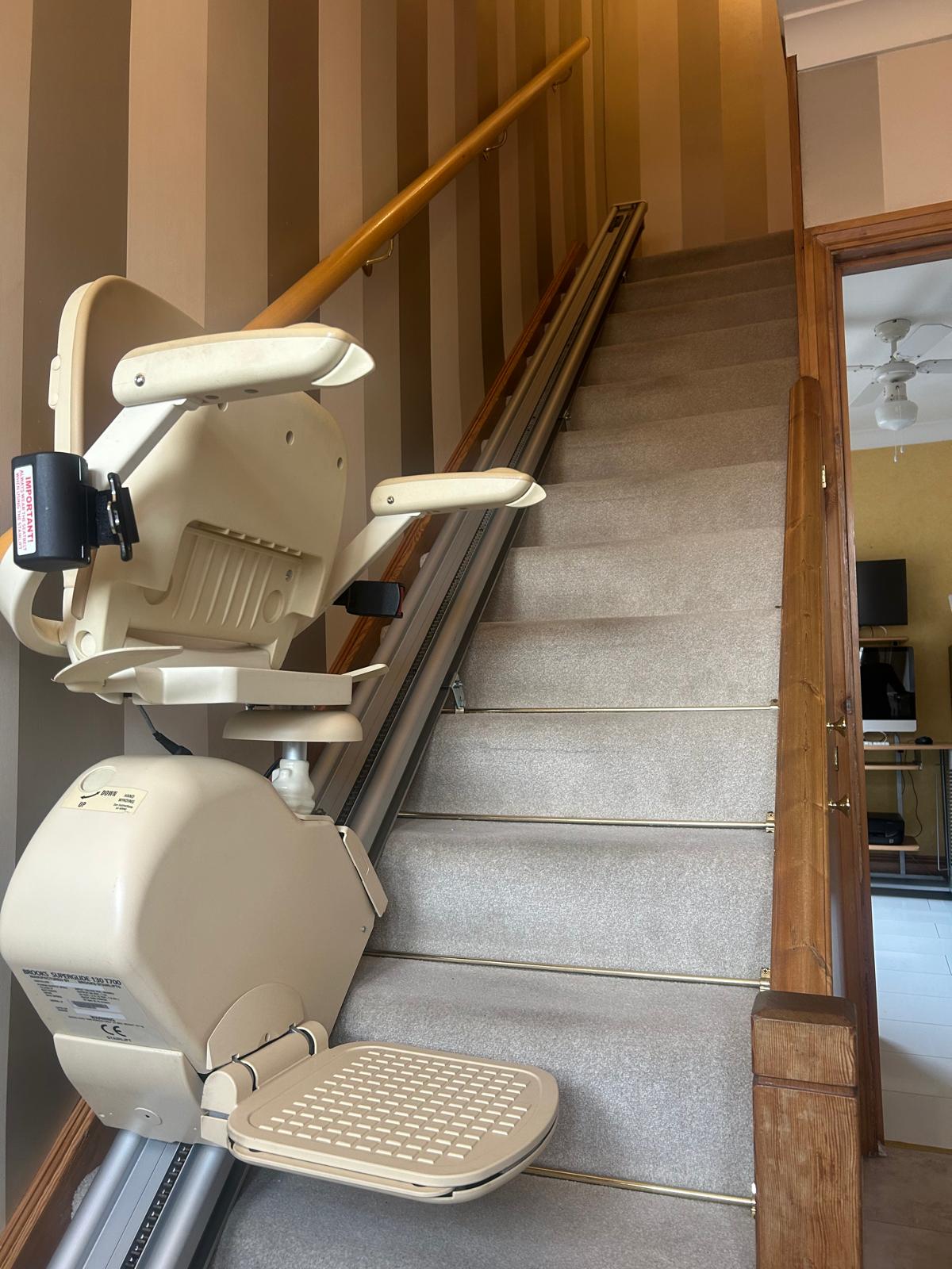 Straight stairlift installed on a residential staircase